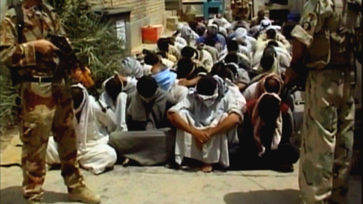 40.men_sitting_hands_down